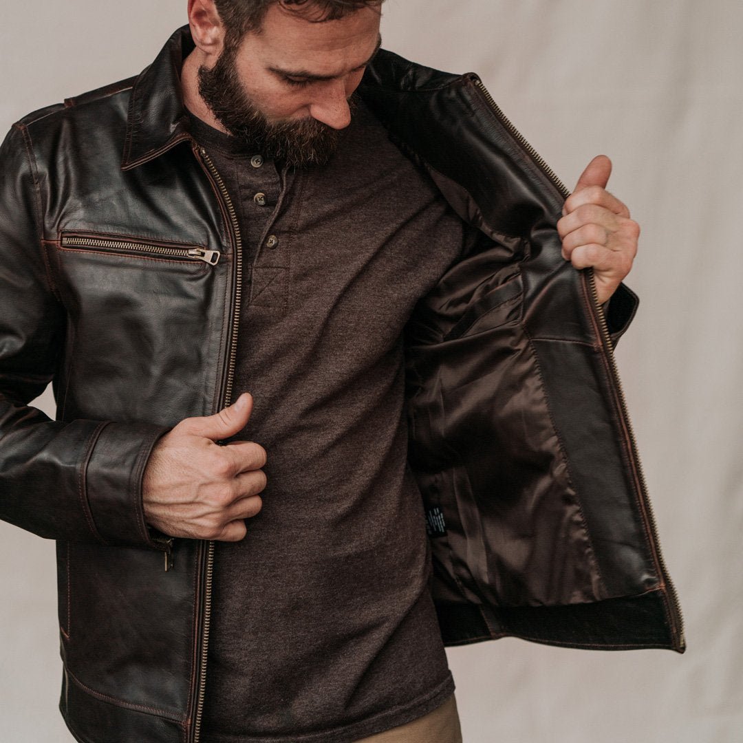 Man wearing the Legacy leather flight jacket in brown