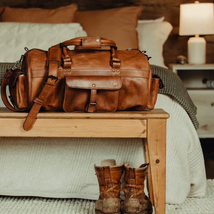 Stylish brown leather duffle bag.