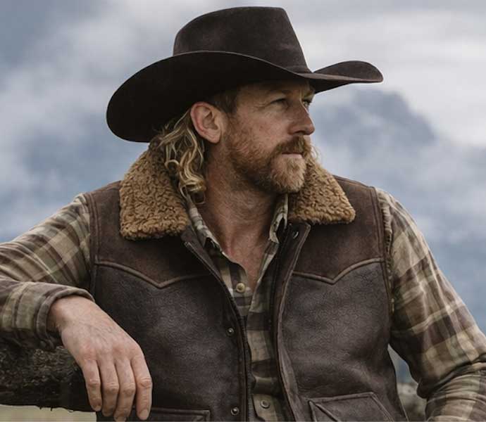Cowboy wearing a shearling-lined leather vest
