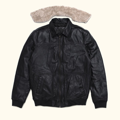 Versatile black leather jacket with front pockets, paired with a removable shearling collar.