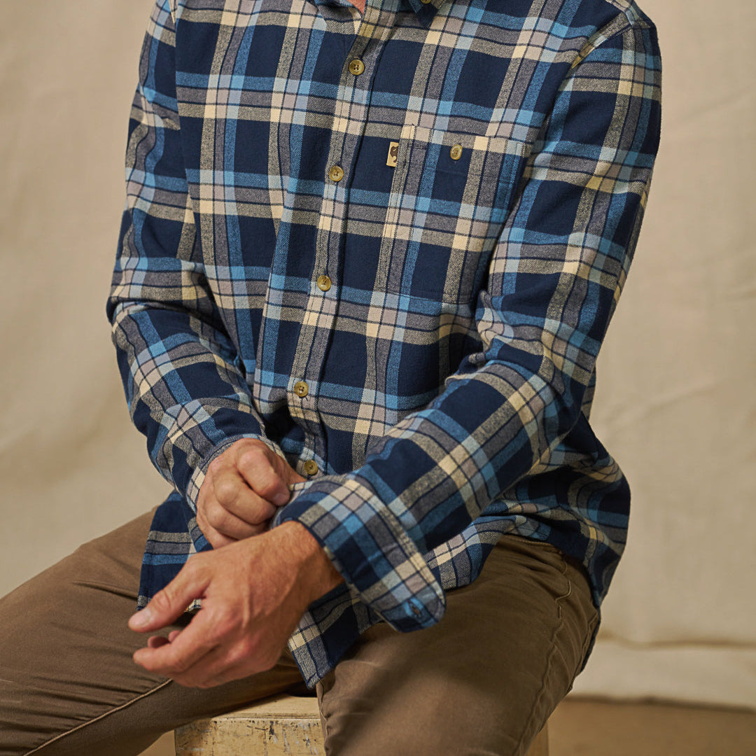 Detail of sleeve and cuff of Fairbanks Flannel Shirt – rugged finish and stout buttons in navy lake plaid design