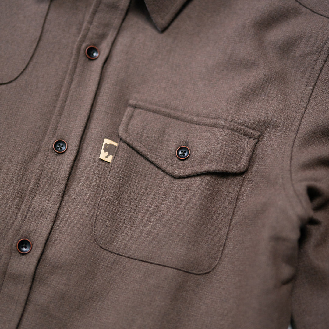 Close texture shot of Gunnison brown wool-blend flannel revealing fabric weave, soft nap, and rugged durability