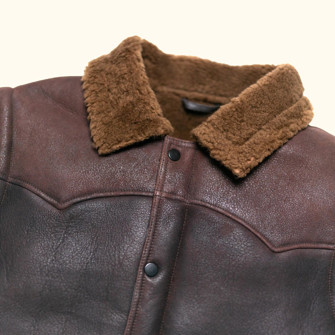 Close view of the shearling collar and cowboy yoke stitching on the Jackson Leather Shearling Vest