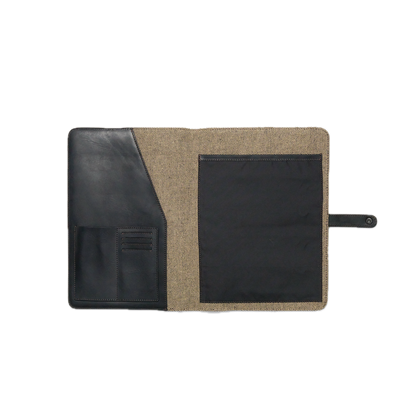 Two-tone leather and fabric pouch with a black flap on a white background
