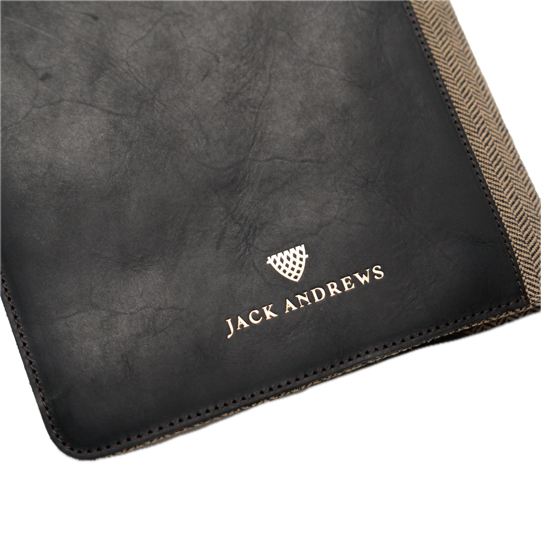 Black leather product with 'Jack Andrews' branding on a white background