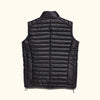 This black leather vest combines the classic puffer style with premium materials, ideal for a contemporary look.