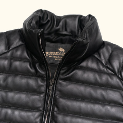 High-quality black leather puffer vest, offering both warmth and a refined sense of fashion.