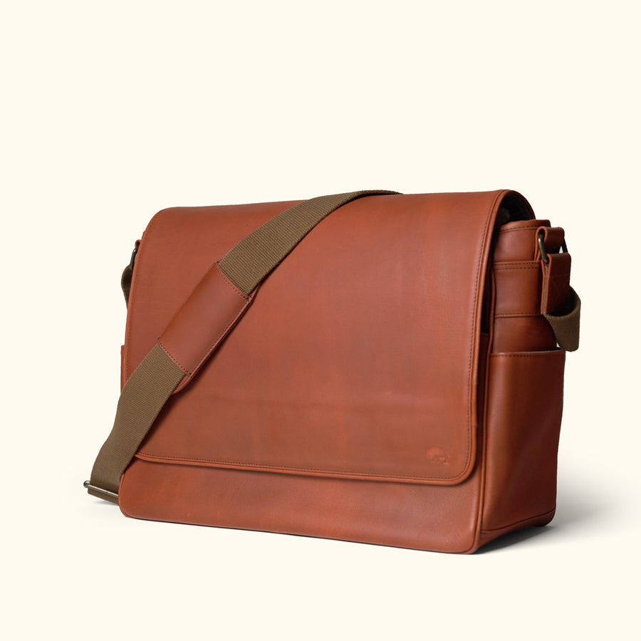 Classic amber brown leather satchel messenger, perfect for professional use with its large capacity and elegant look.