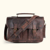Professional dark oak leather briefcase with classic buckle closures and a robust shoulder strap for stylish carrying.