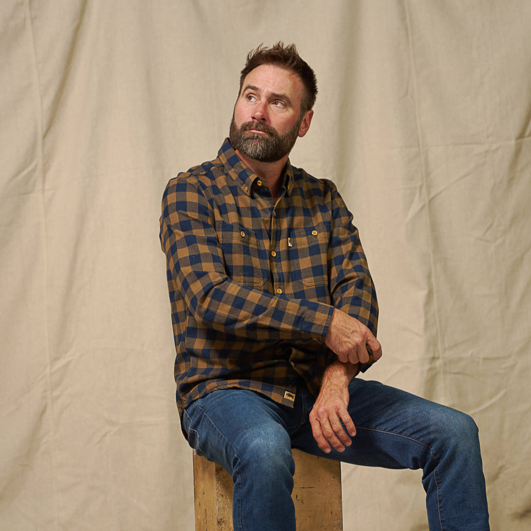 Close-up of sleeve cuff and hem on Waxhaw Buffalo Plaid Flannel Shirt Navy and Brown emphasizing durability and construction
