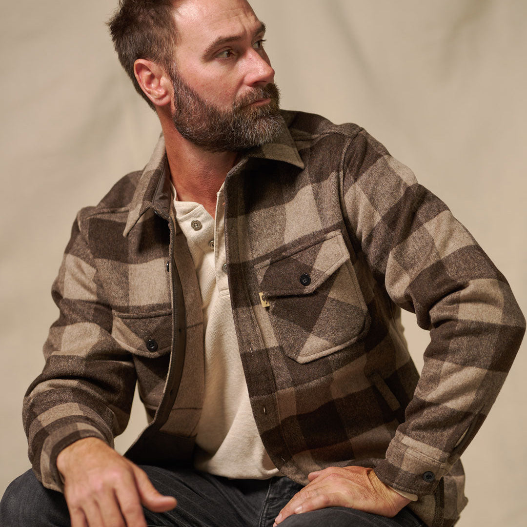 Styled outdoor shot of Yukon Wool Shirt Jac Buffalo Check worn over tee for layering warmth in rustic setting