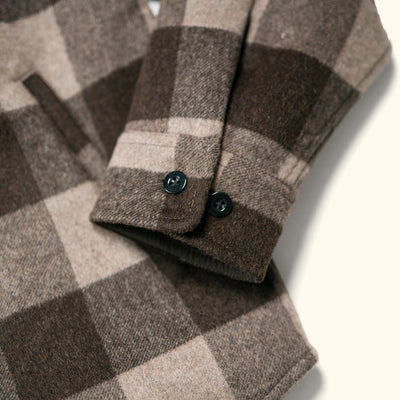Flat lay of Yukon Wool Shirt Jac Buffalo Check showing distinctive buffalo check pattern and mid-to-heavy weight brushed wool fabric