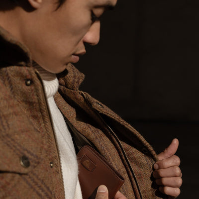 Close-up of the Aberdeen Wool Jacket in Dunbar Thicket worn open over a turtleneck