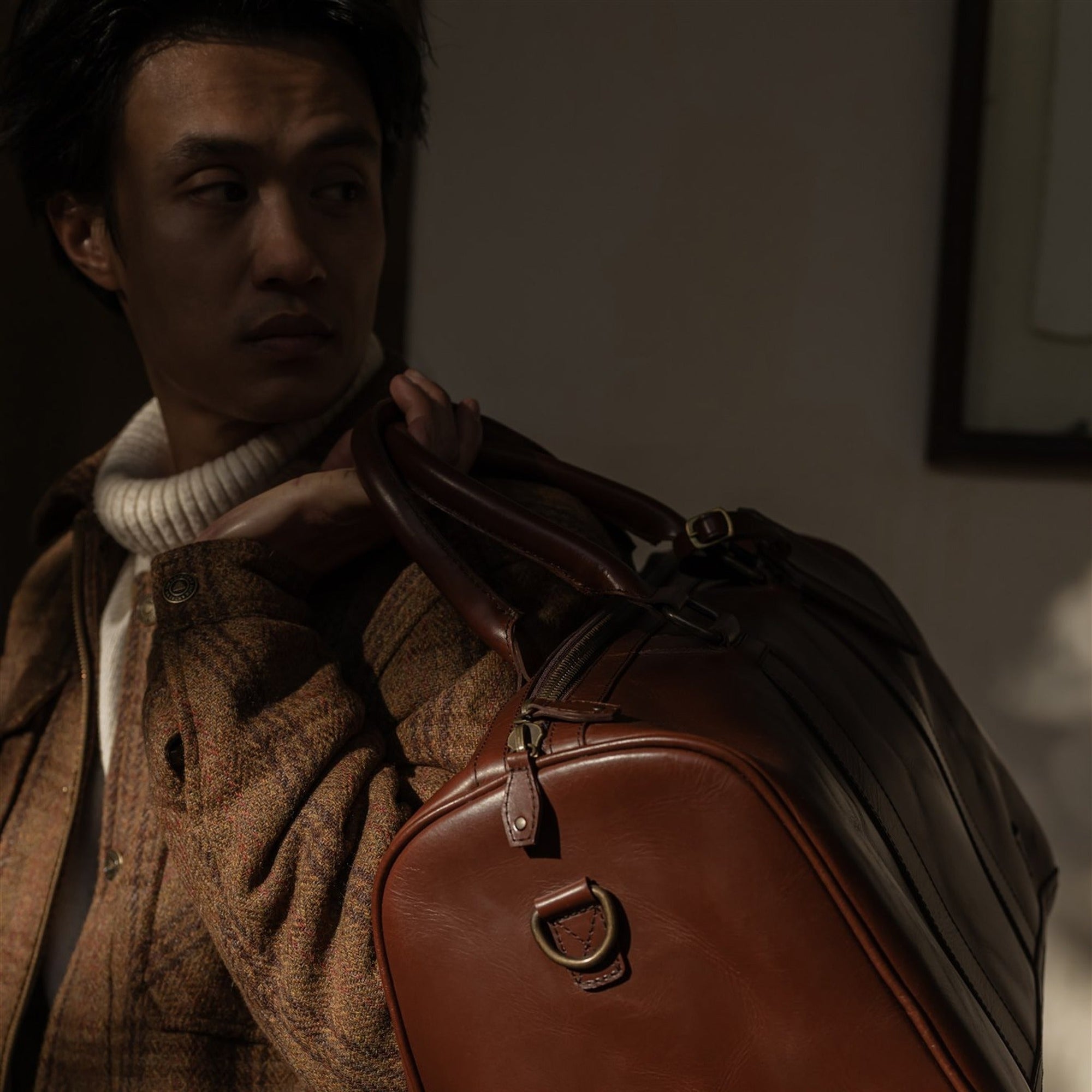 Aberdeen Wool Jacket in Dunbar Thicket with a brown leather bag over the shoulder