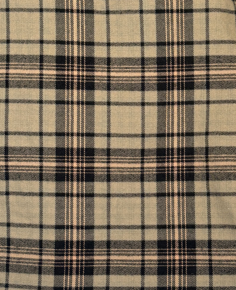 A close-up of a plaid fabric pattern with a beige base and intersecting black and thin tan stripes.