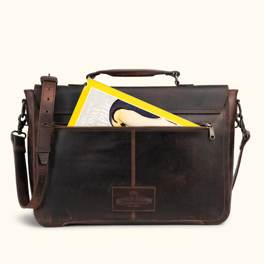 Vintage dark brown leather messenger bag with aged patina, featuring sturdy handle, adjustable strap, and classic front buckle closure.