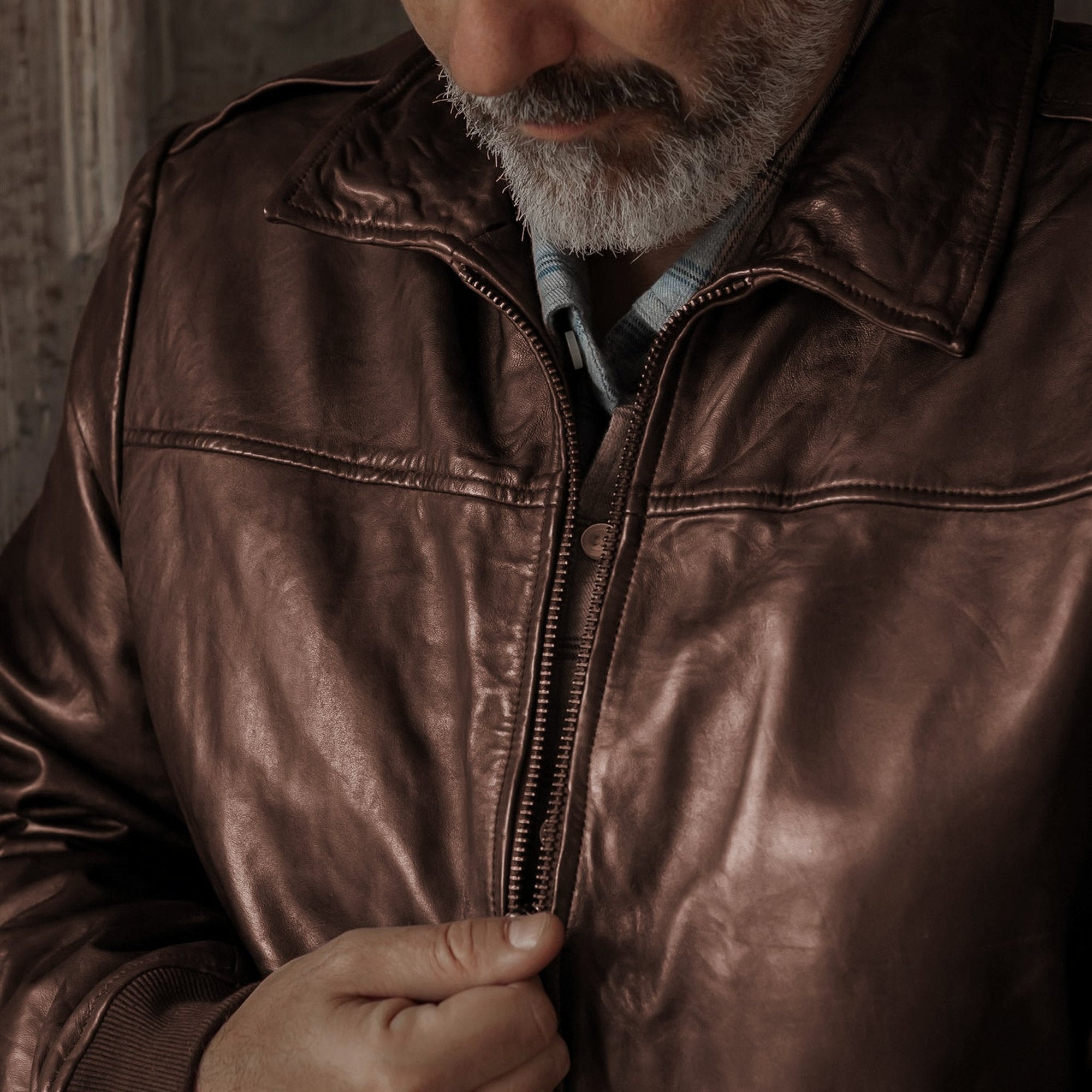 Close view of the Glenwood Leather Driving Jacket in Mahogany Brown, showing the zip front and full-grain leather.