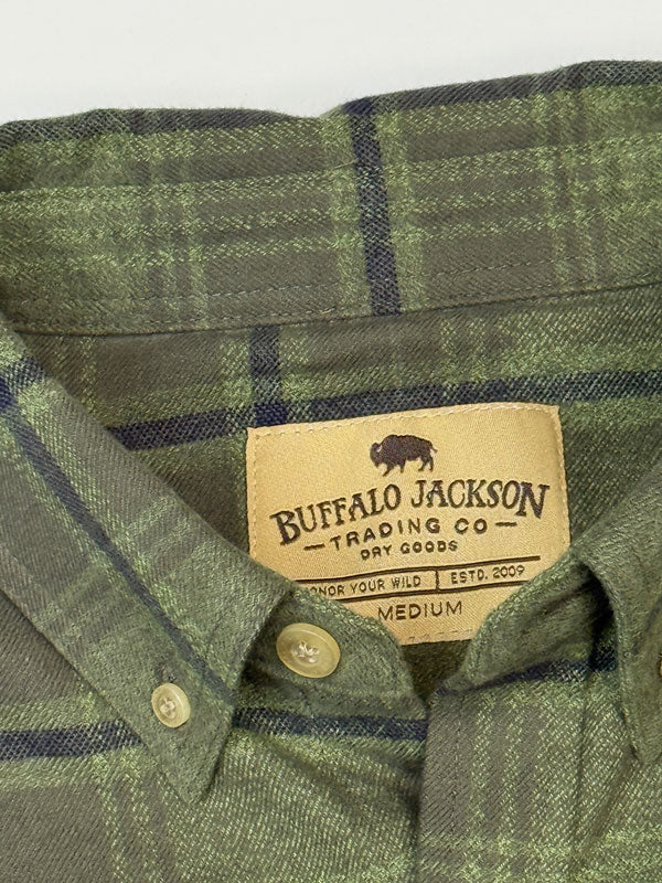 Close-up of a Buffalo Jackson plaid button-down shirt collar, showing the brand label and green and navy woven fabric.