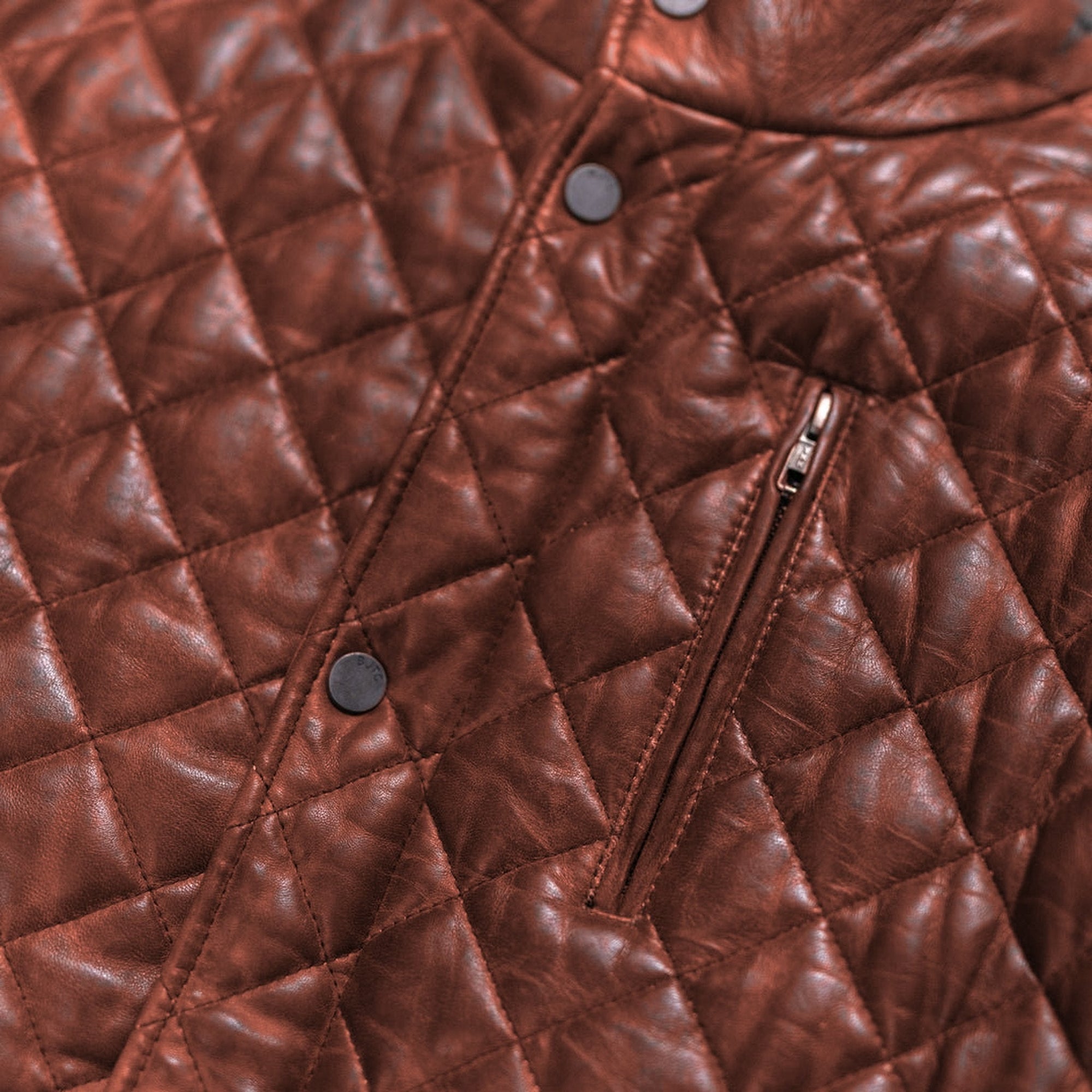 Highlands Quilted Leather Jacket in Whiskey Brown, zippered chest pocket detail.