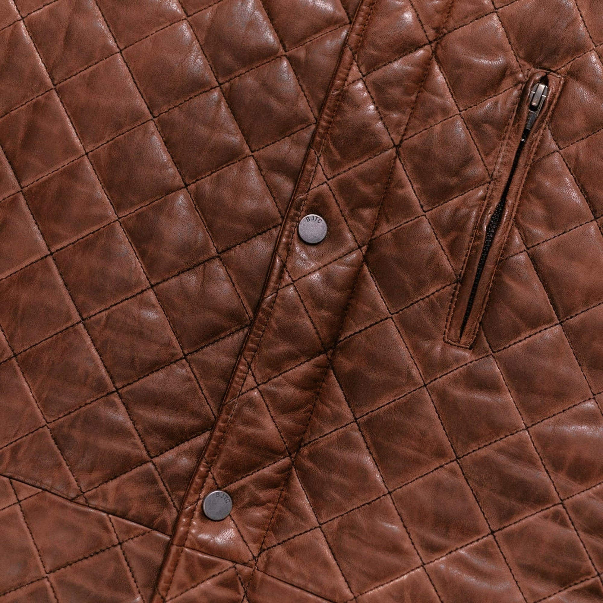 Highlands Quilted Leather Vest in Whiskey Brown, zippered chest pocket detail.