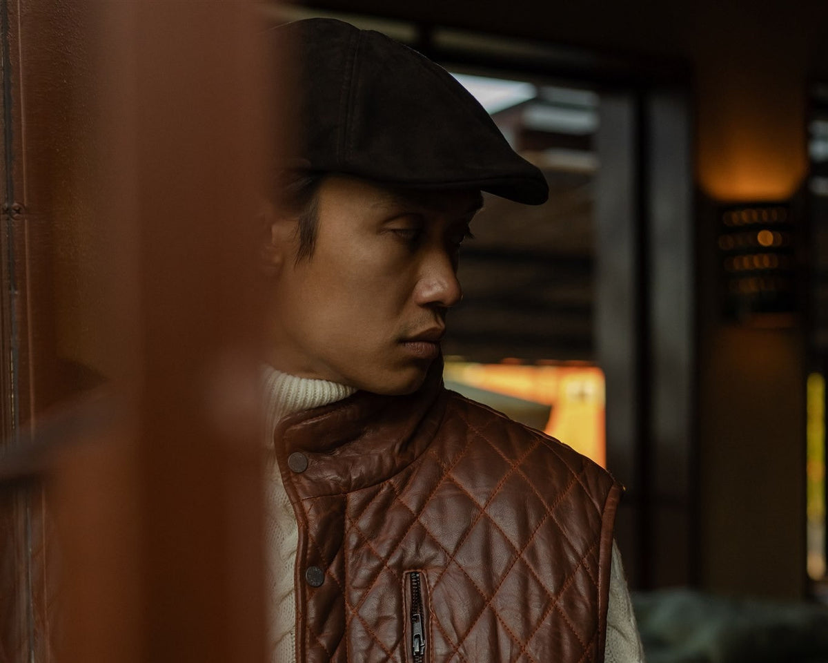 Highlands Quilted Leather Vest worn over a cable-knit sweater