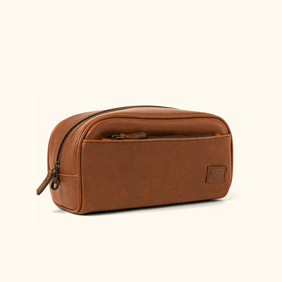 Jefferson Leather Dopp Kit in Elderwood Brown, front three-quarter view.