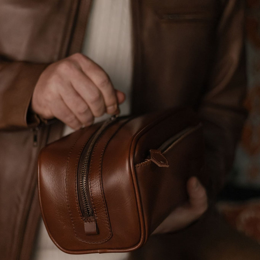 Jefferson Leather Dopp Kit in Elderwood Brown, front three-quarter view.