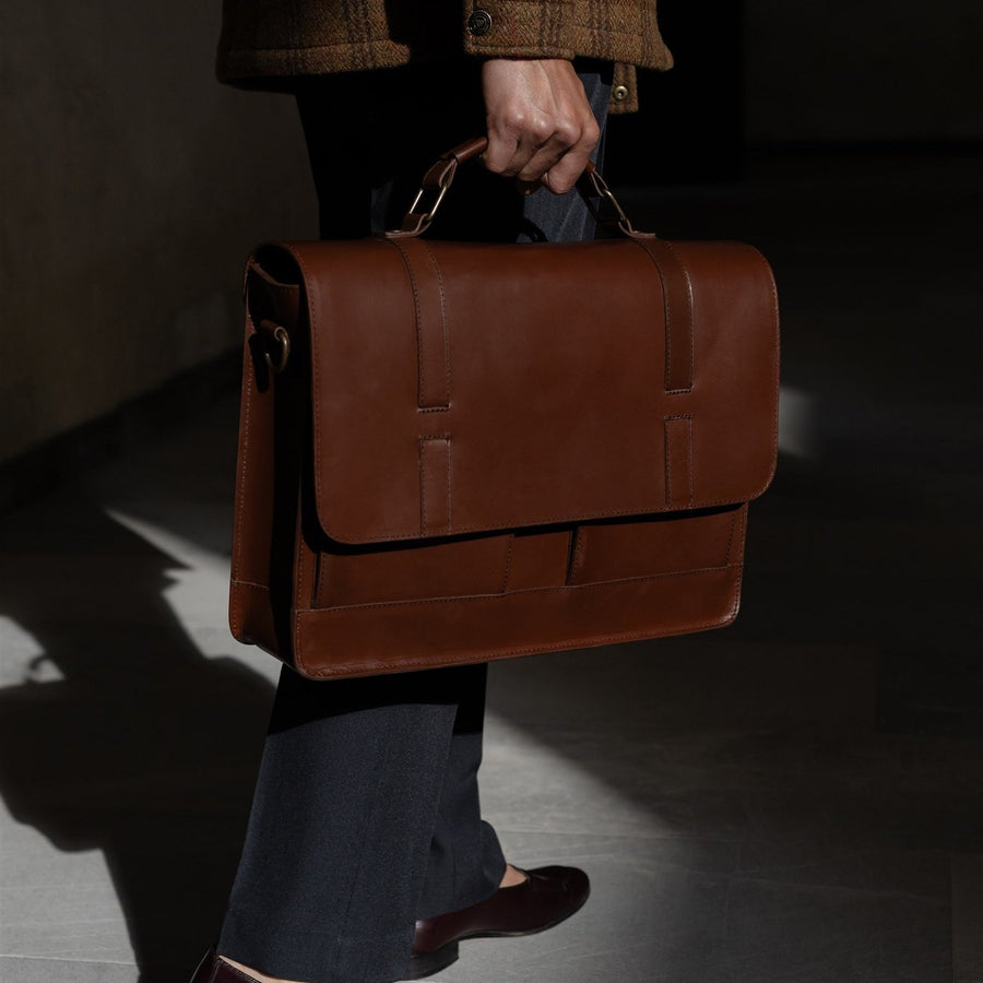 Jefferson Leather Messenger Bag in Elderwood Brown, front three-quarter view.