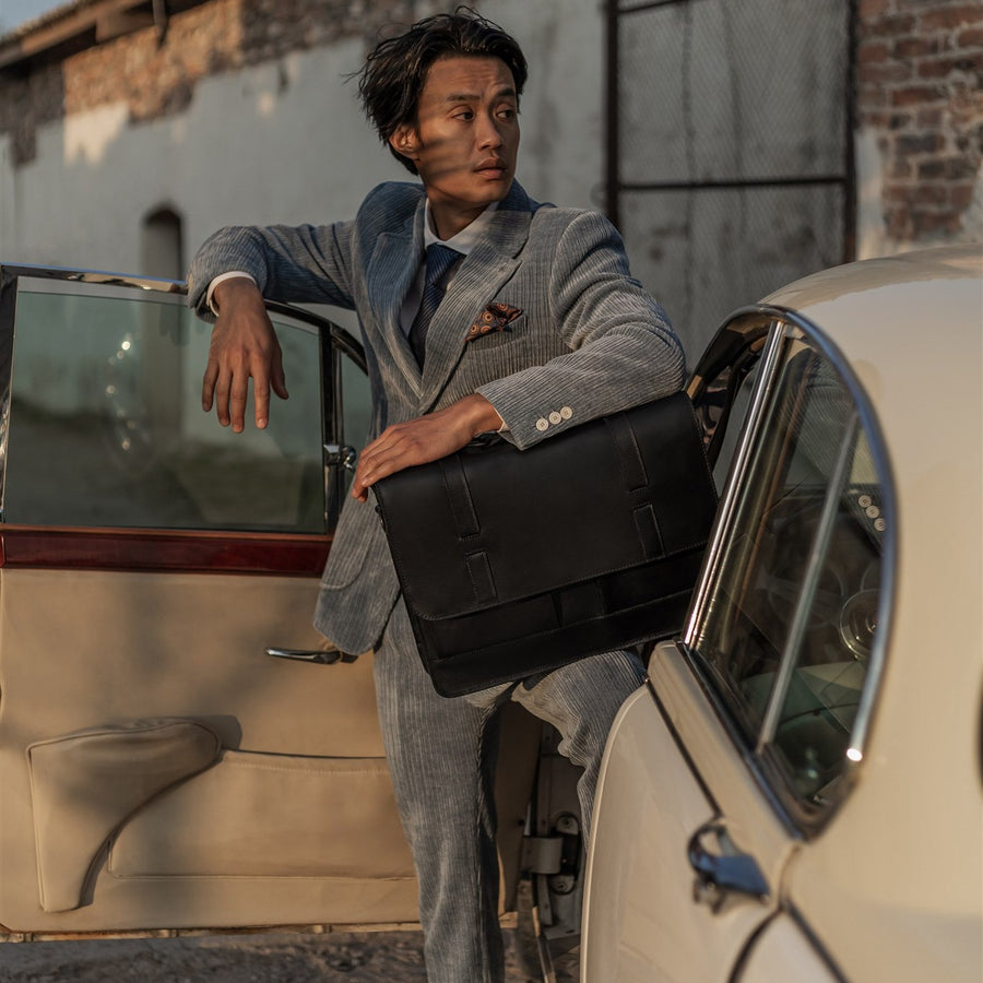 Jefferson Leather Messenger Bag in Vintage Black, front three-quarter view.