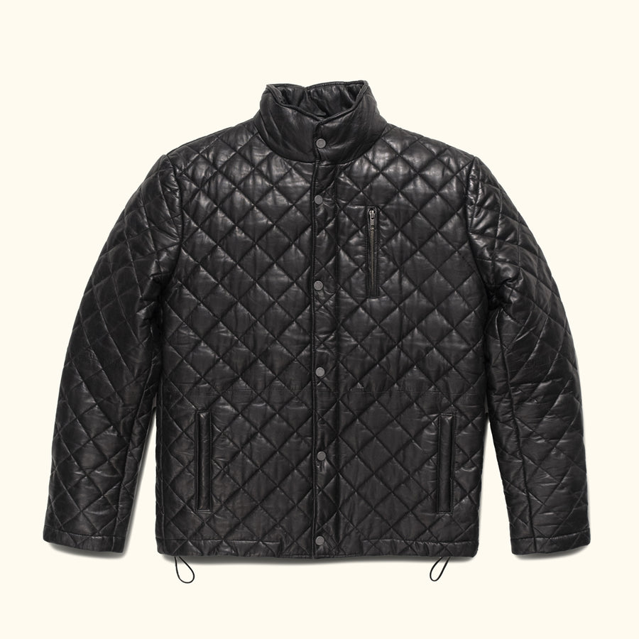 Man with arms crossed in the Highlands Quilted Leather Jacket in Black.
