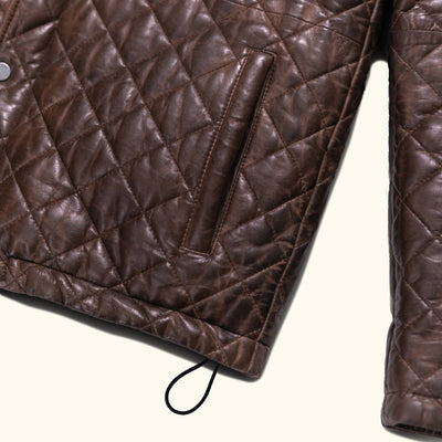 Stylish and warm, this mahogany brown quilted leather jacket is perfect for the modern gentleman.