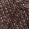 Quilted leather jacket in rich mahogany brown, perfect for cool weather with its cozy design.