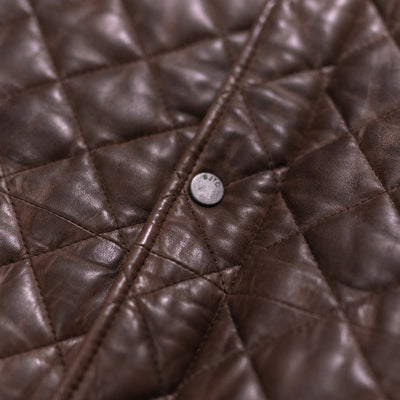 Front view of a premium mahogany brown leather jacket with a quilted pattern and secure fastenings.