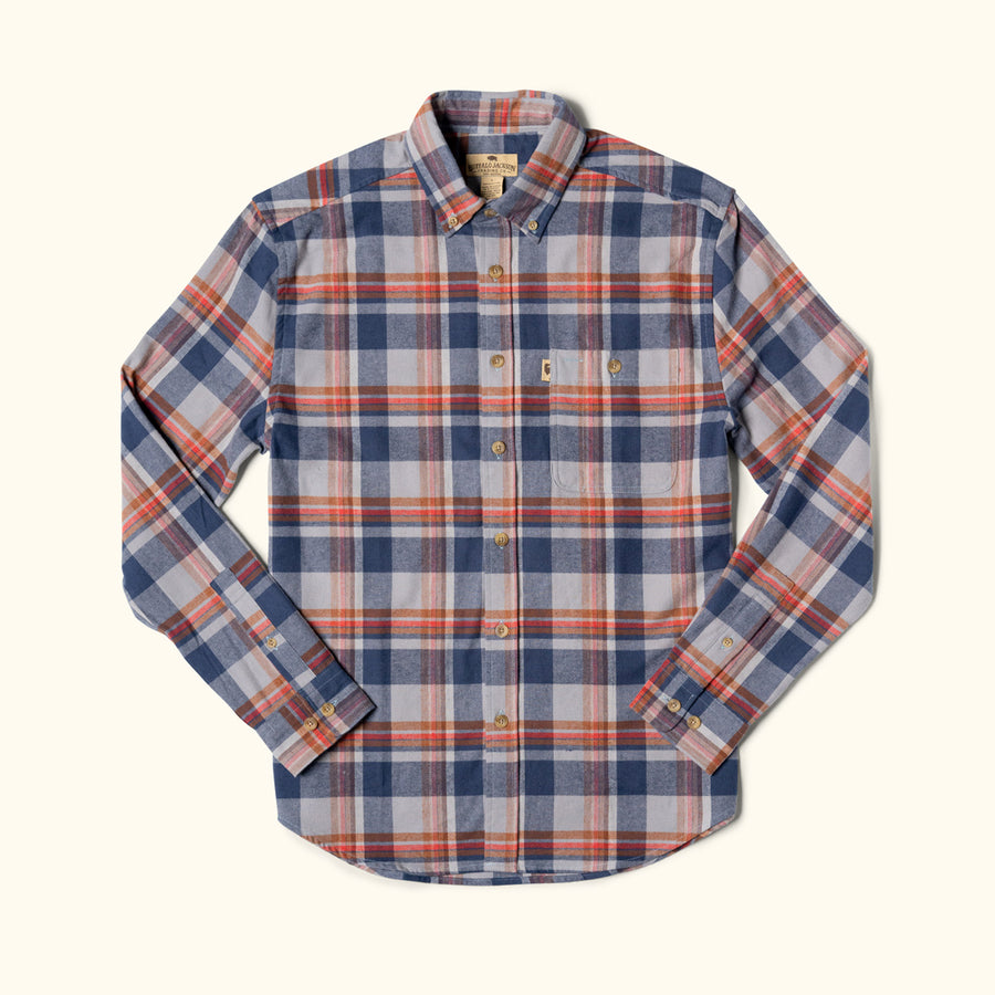 Plaid shirt with blue, red, and beige pattern on a white background