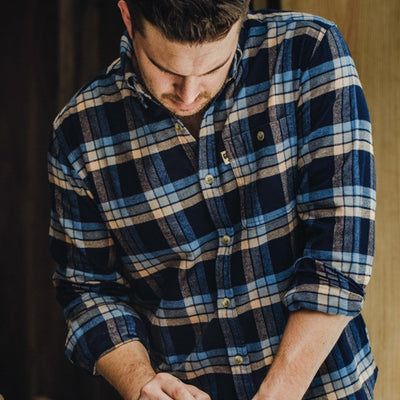 Fairbanks Flannel Shirt being worn outdoors rugged styling navy lake plaid – ready for hiking or casual wear