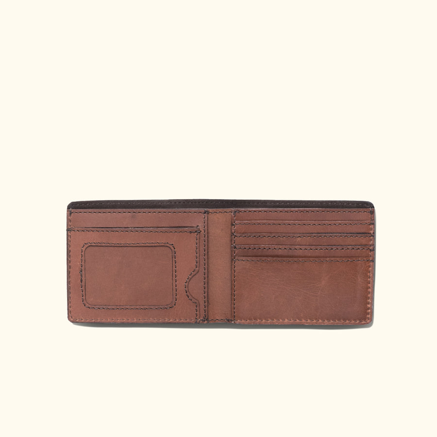Amber brown Roosevelt leather billfold wallet with sleek design and fine stitching detail.