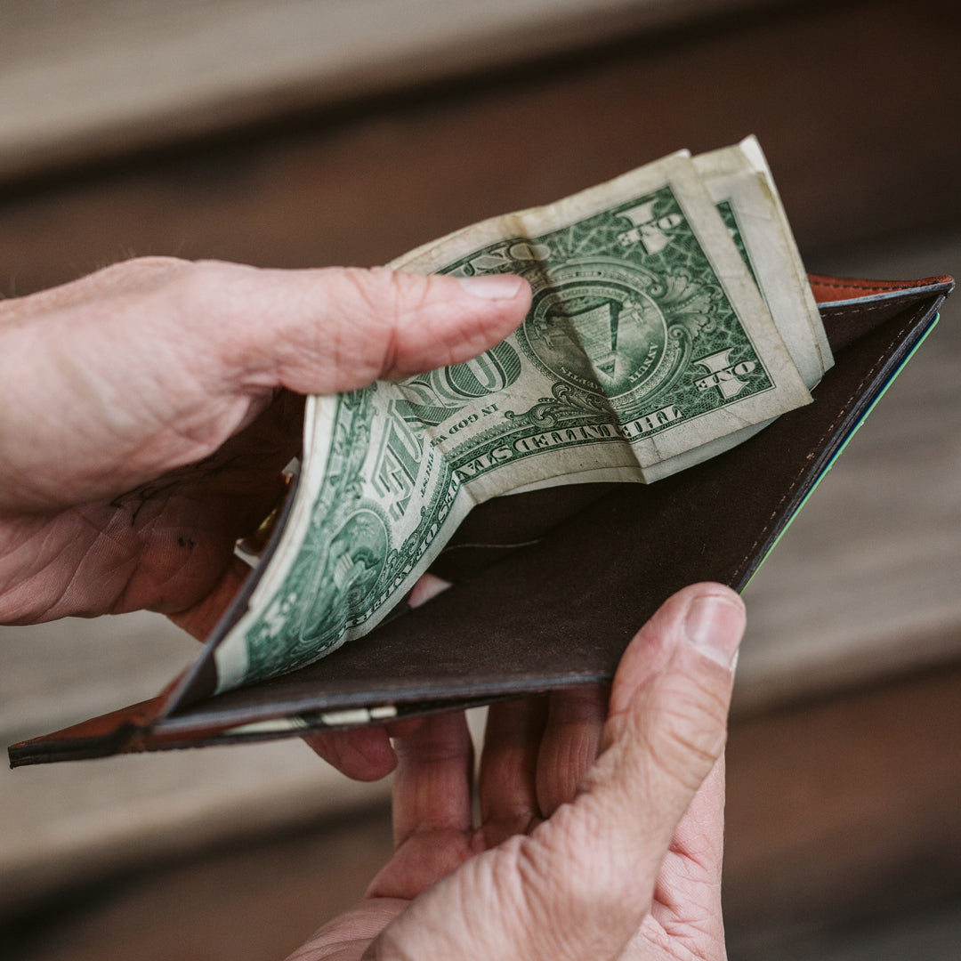 Durable and chic amber brown leather billfold wallet, ideal for everyday use with a minimalist design.