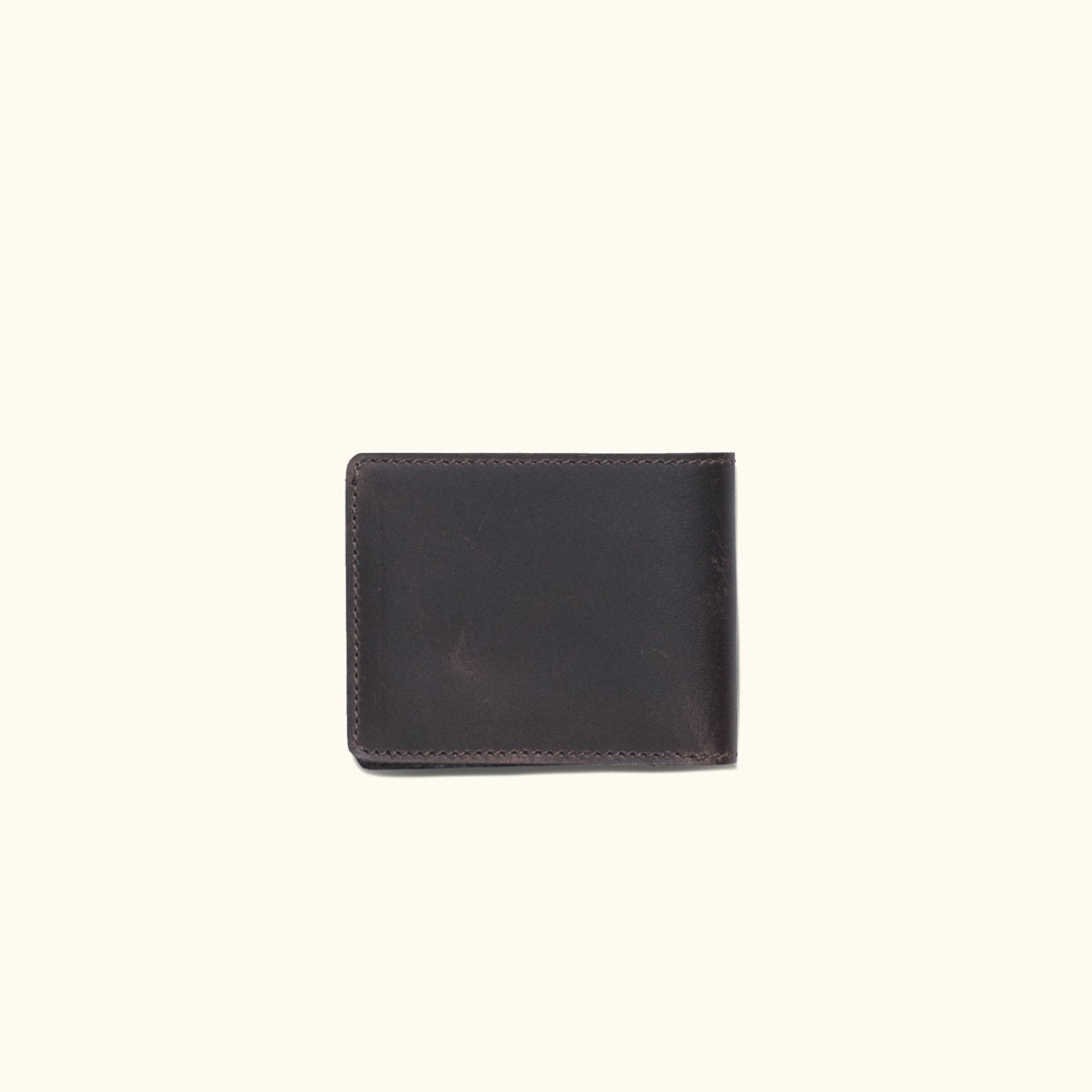 Elegant dark oak leather billfold wallet, compact and sleek for storing cash and cards securely.