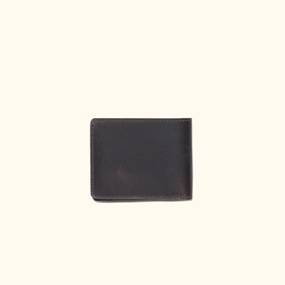 Elegant dark oak leather billfold wallet, compact and sleek for storing cash and cards securely.