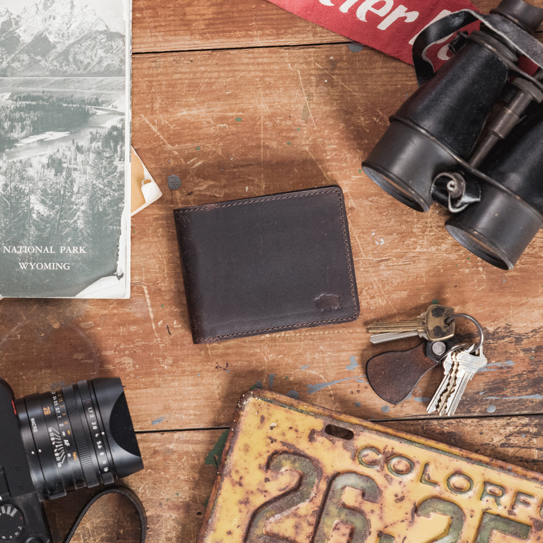 Luxurious dark oak leather billfold, perfect for a sophisticated look with practical internal layout.