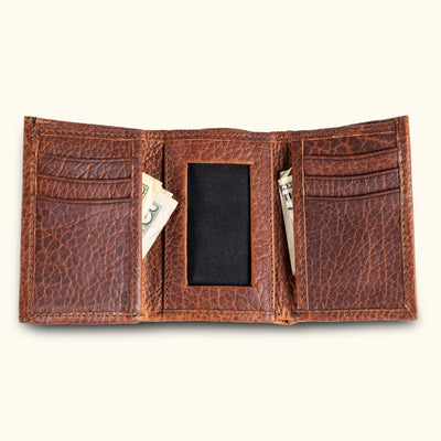 Inside view of a brown bison leather trifold wallet, showcasing its organized compartments for cards, cash, and ID, designed for the modern man who values functionality and sophistication.