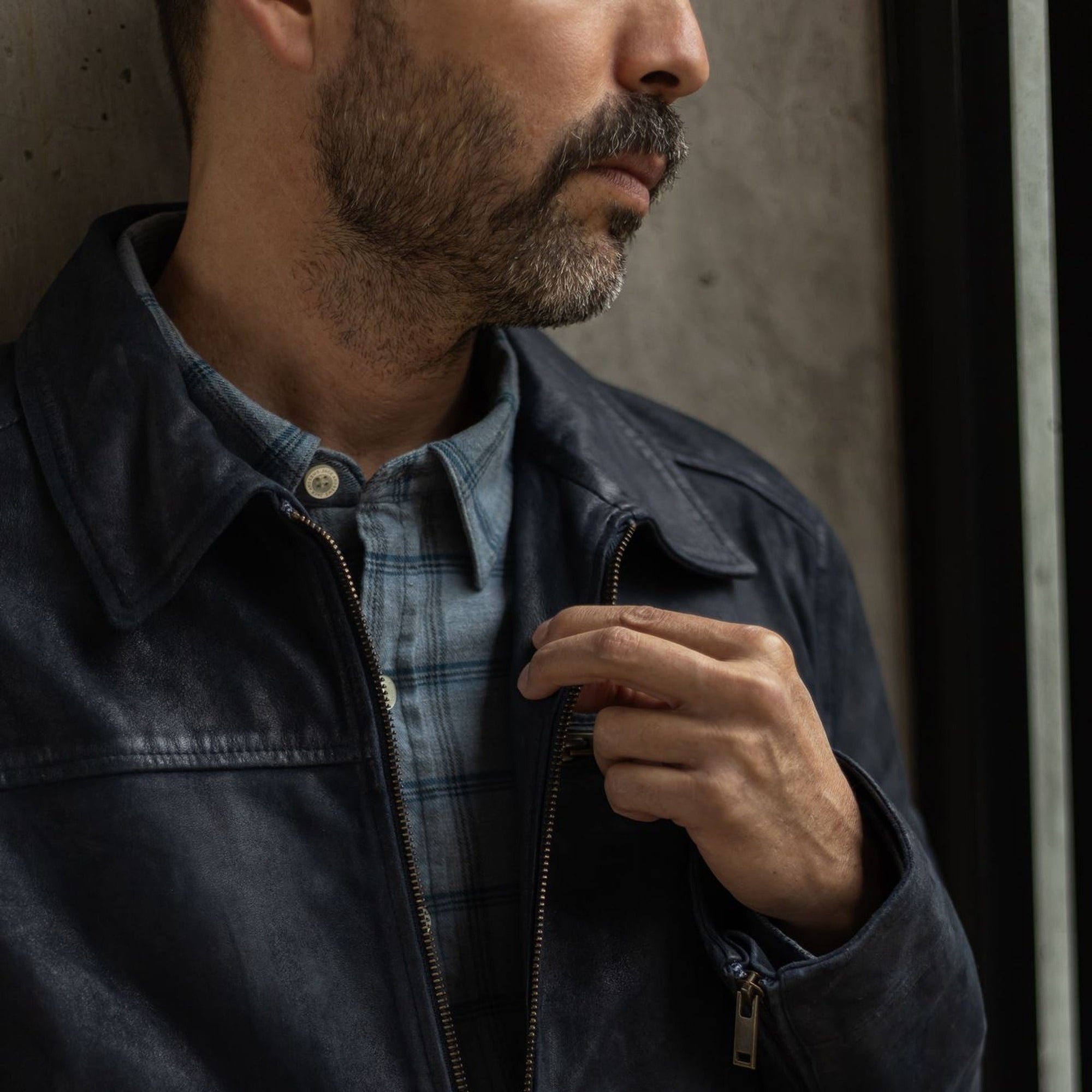 Close-up of the Windsor Cotton Shirt in Sky Pane under a dark denim jacket