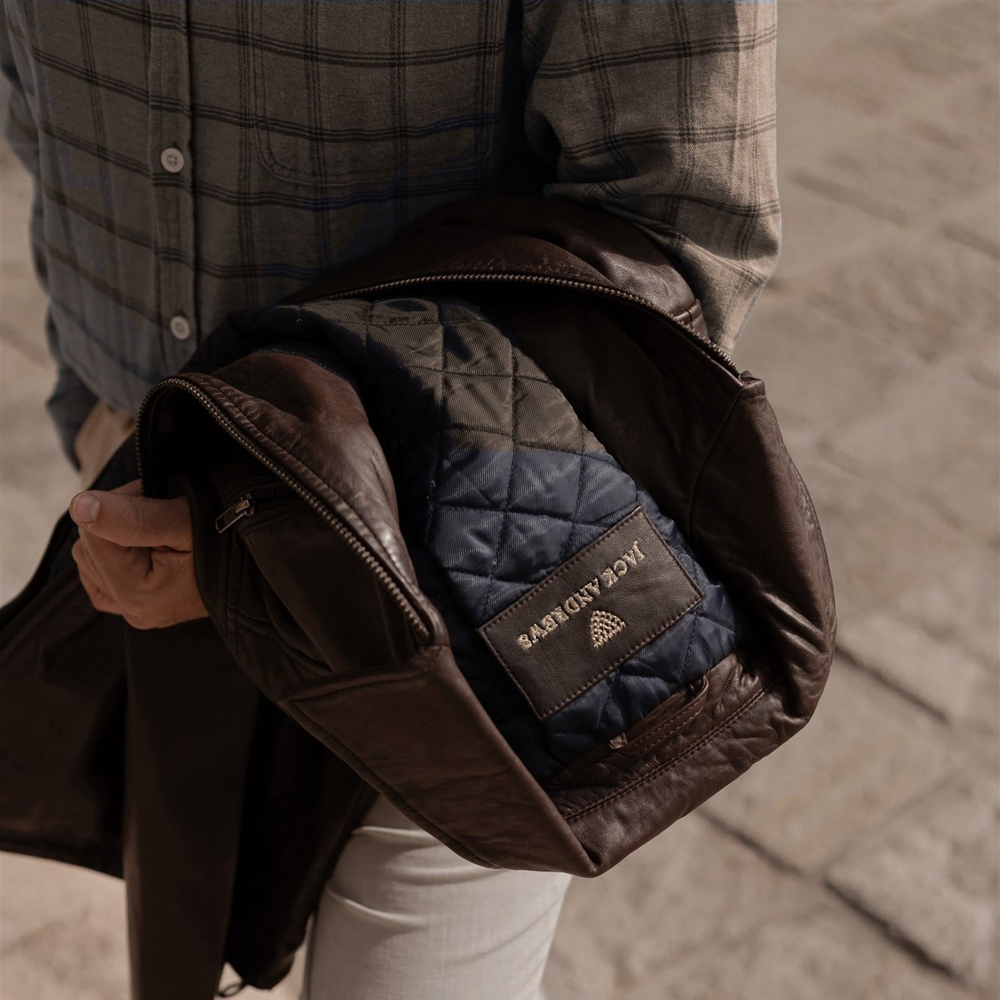 Windsor Cotton Shirt in Timber Pane with a leather jacket over the arm