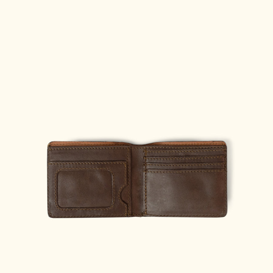 This classic billfold wallet, handcrafted from true leather. Made for men, hand stitched, and crafted with quality.  