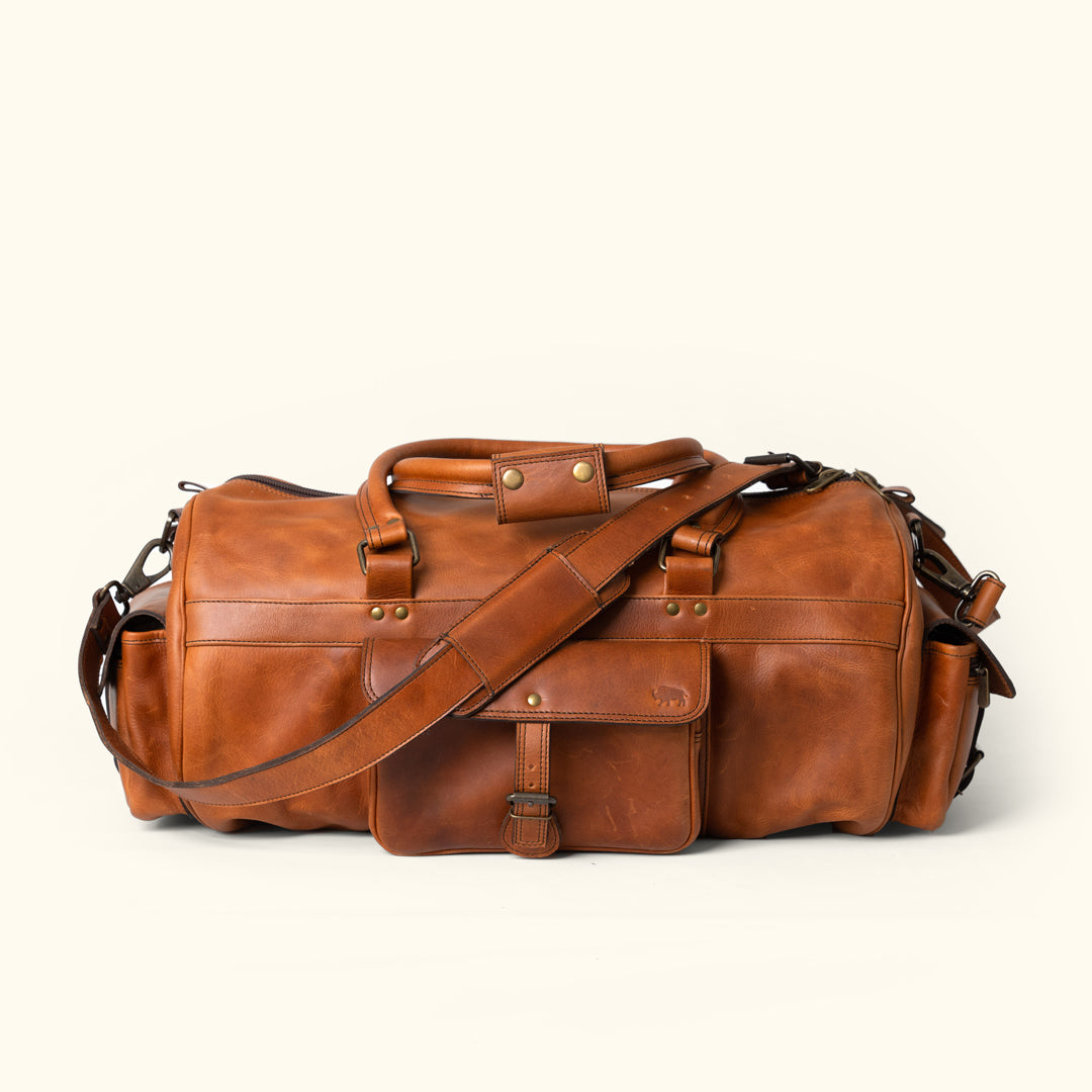 Autumn Brown Buffalo Leather Duffle Bag: Handcrafted, spacious, durable, multi-pocket design, adjustable straps, ideal for extended travel and rugged adventures.