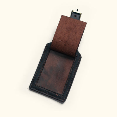 Dark oak Roosevelt leather luggage tag with sturdy loop and contrast stitching.