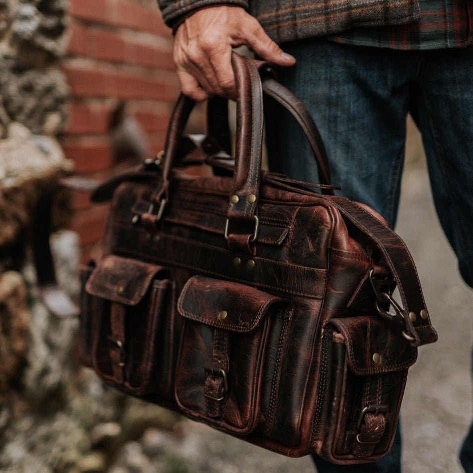  Men's Leather Pilot Bag in Dark Oak, handcrafted, spacious compartments, durable stitching, antique buckles, perfect for sophisticated travelers.