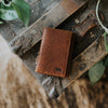 An exquisite brown bison leather slim wallet, showcasing impeccable craftsmanship and a sleek profile for the discerning individual.